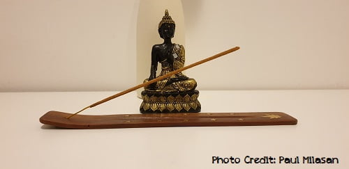 decorating a yoga meditation altar with incense or statues